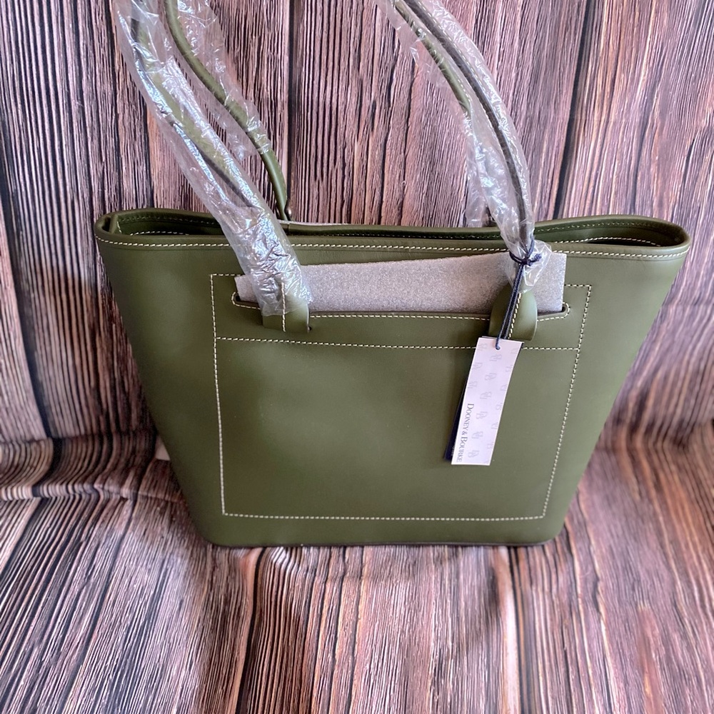 Beautiful olive green tote by Dooney & Bourke. A bag you will absolutely love.